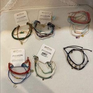 A bunch of pura vida bracelets some with tags!!
